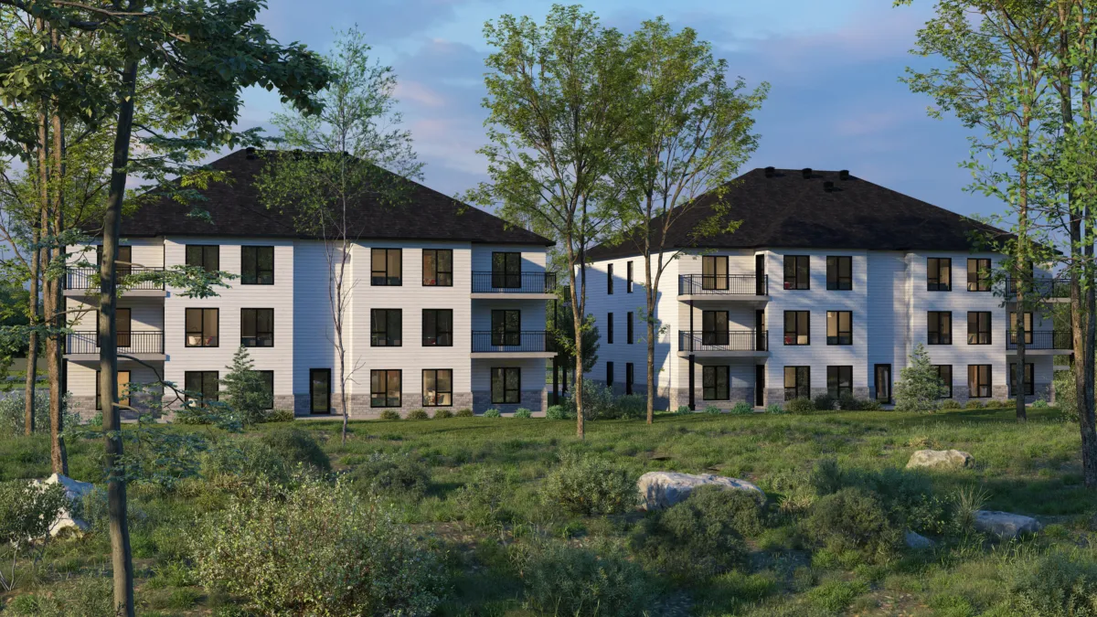 3D rendering of two three-storey residential buildings at the edge of a wooded lot, late in the day